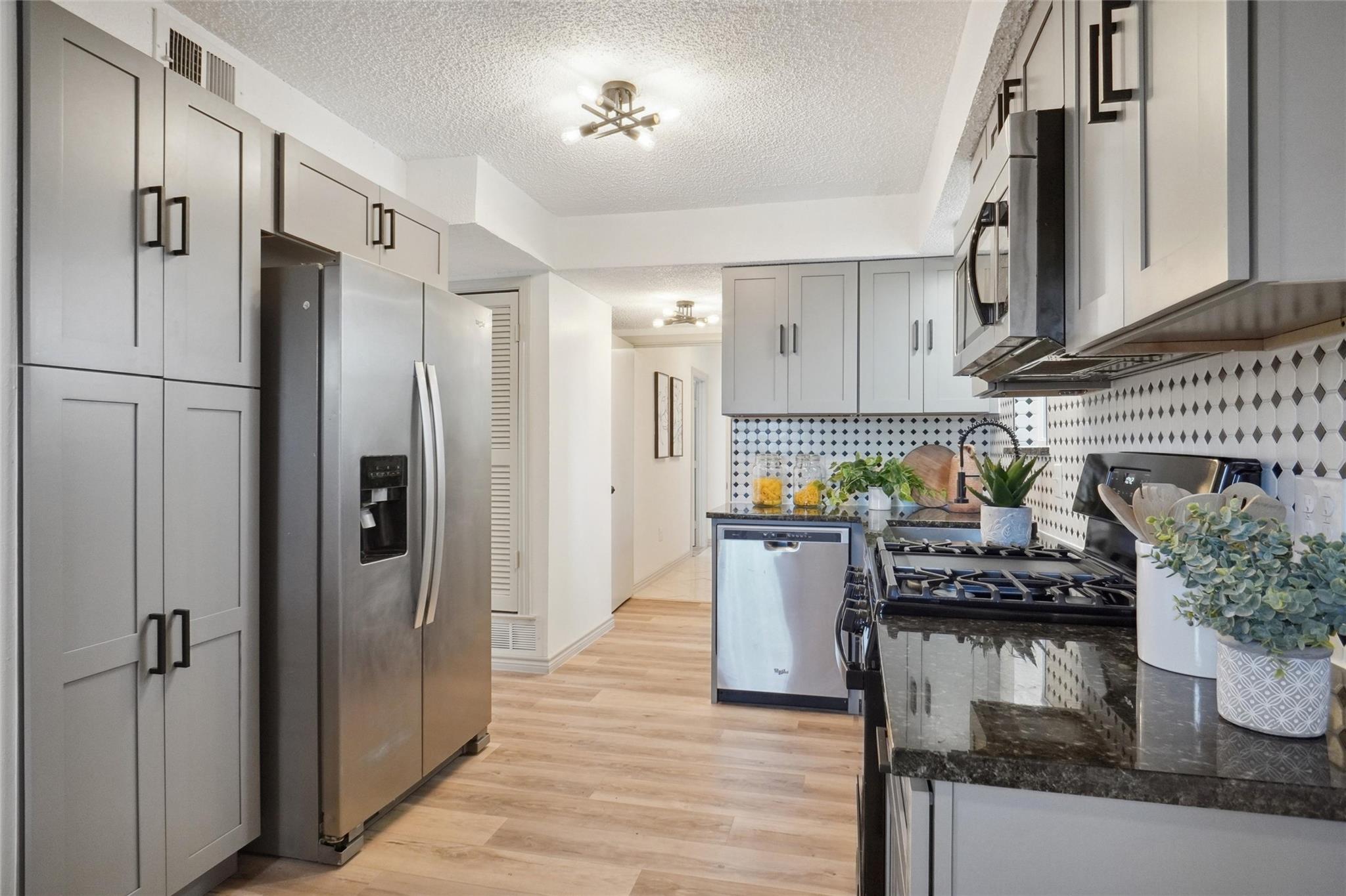 new kitchen remodel by a general contractor in Rosye City, TX with new countertops, flooring, and cabinets.